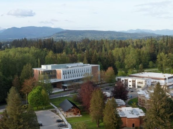 Trinity Western University campus in Langley BC with distant green landscape